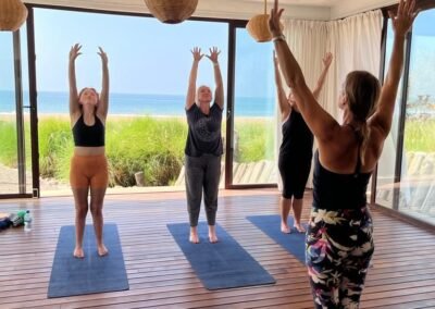 Ros Cox Wellness hosting pilates class by the sea